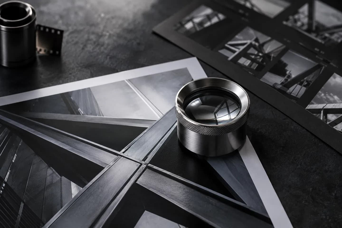 Steel loupe over architectural metal photographs