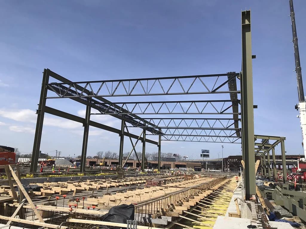 Steel columns and roof trusses during structural assembly