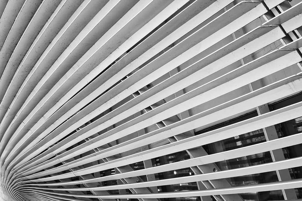 Curved architectural metal fins across a building facade