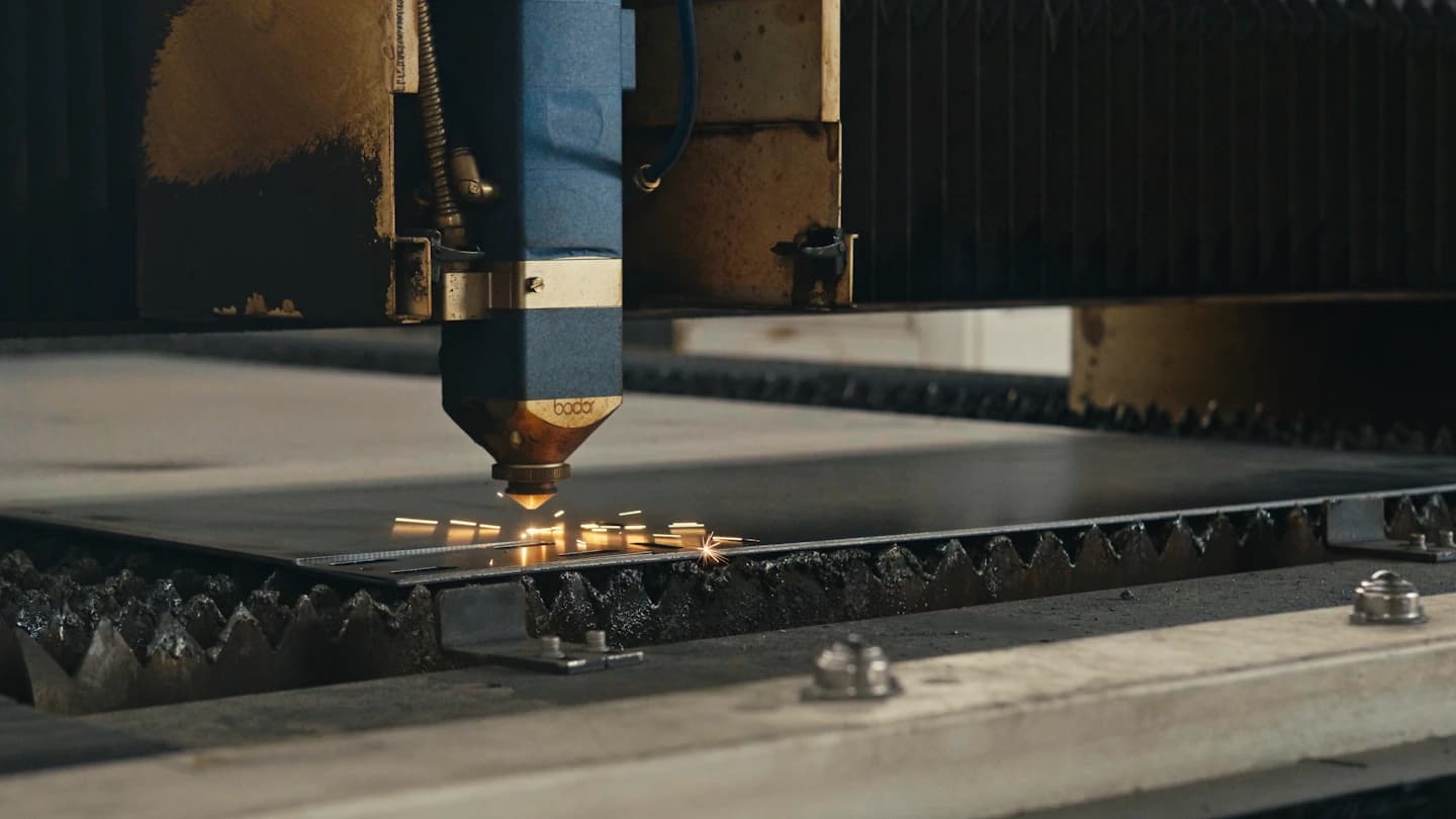 Laser cutting a metal sheet