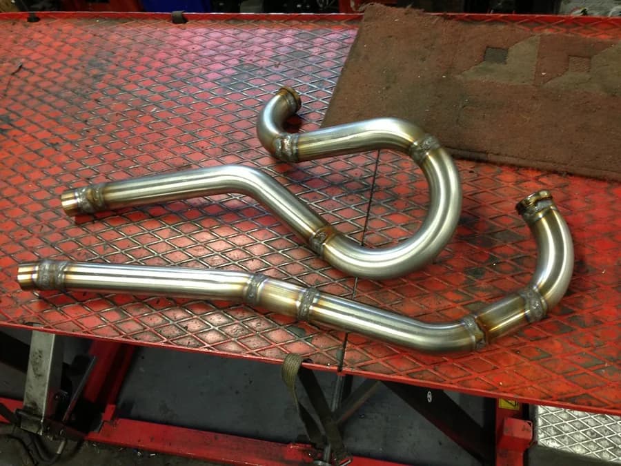 Welded stainless steel tube assemblies on a workbench