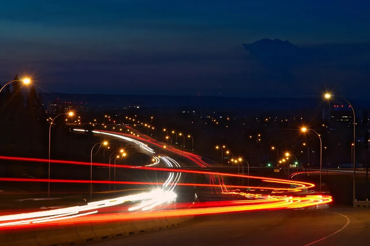 Vehicle light trails on a Fort McMurray roadway at night