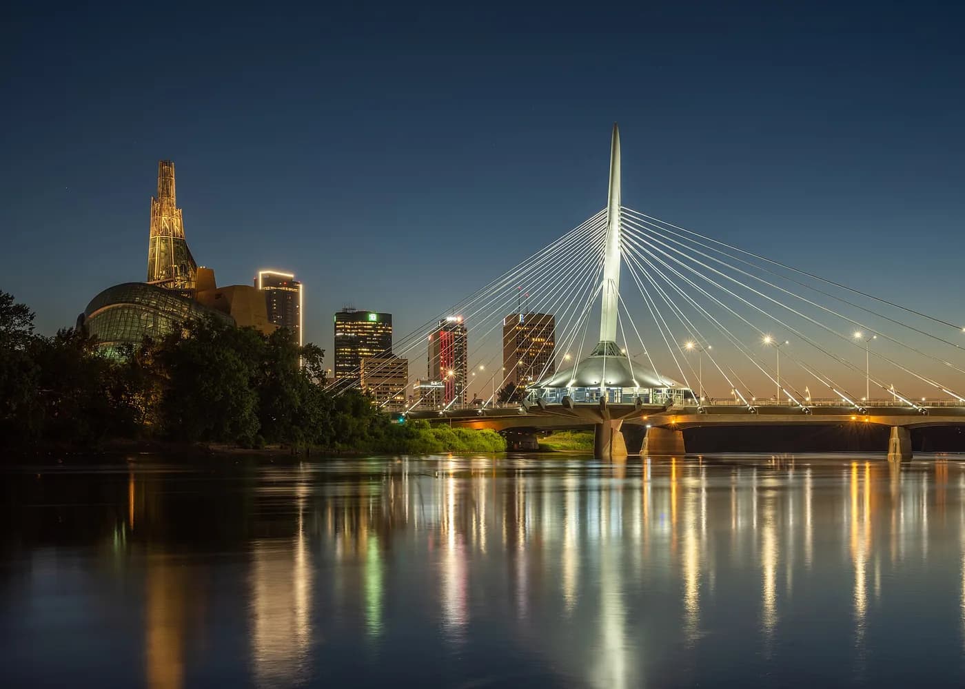 Esplanade Riel Bridge and Winnipeg skyline at dusk