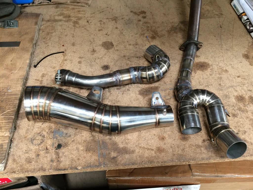 Fabricated stainless steel pipe sections with welded joints